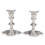 A PAIR OF GEORGE II SILVER PIANO CANDLESTICKS
