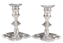 A PAIR OF GEORGE II SILVER PIANO CANDLESTICKS