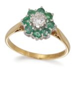 AN 18 CARAT GOLD EMERALD AND DIAMOND CLUSTER RING