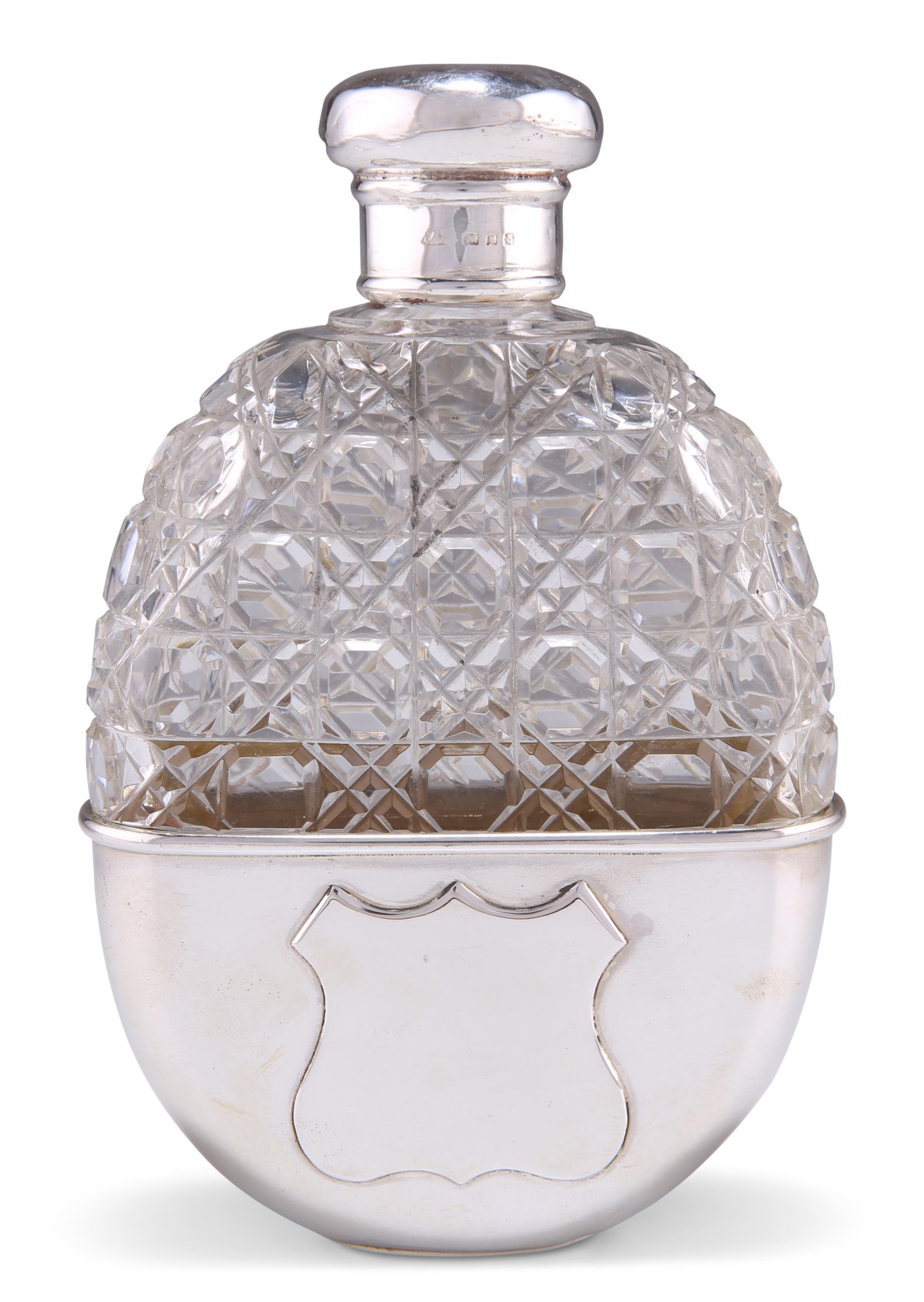 A LARGE SILVER-MOUNTED CUT-GLASS SPIRIT FLASK