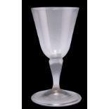 A SILESIAN STEM WINE GLASS, CIRCA 1760, with bucket bowl, of grey metal, on a folded foot. 11.5cm