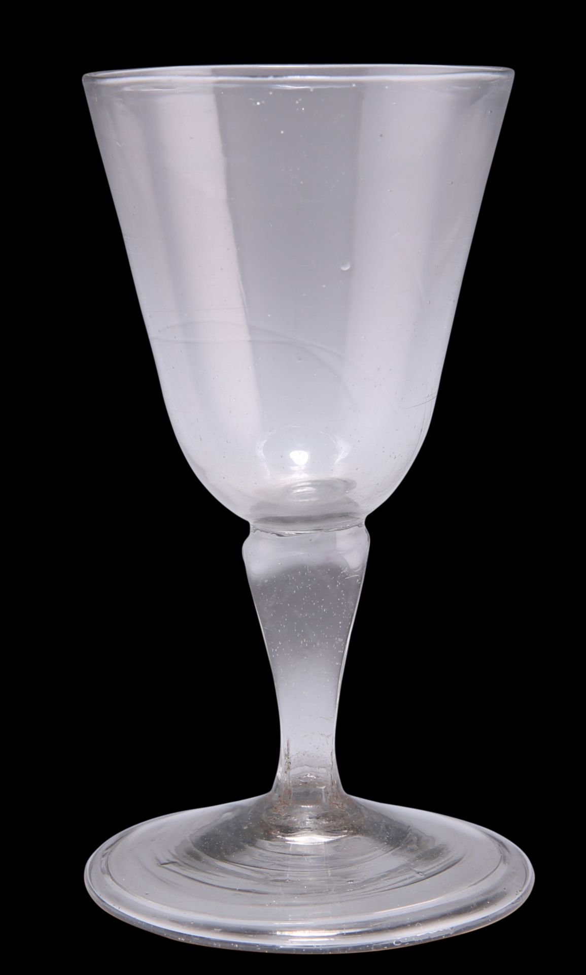 A SILESIAN STEM WINE GLASS, CIRCA 1760, with bucket bowl, of grey metal, on a folded foot. 11.5cm