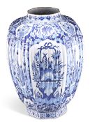 A LARGE 18TH CENTURY DUTCH DELFT BLUE AND WHITE VASE, of ribbed octagonal baluster form, with