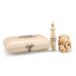 THREE PIECES OF 19TH CENTURY IVORY, comprisingÿAN IVORY PURSE, the hinged cover monogrammed, blue