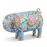 A CHINESE CLOISONNE MODEL OF A PIG, enamel decorated with foliage within raised wirework against a