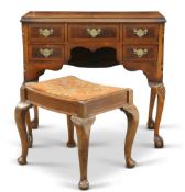 A QUEEN ANNE-STYLE WALNUT DRESSING TABLE, with half-veneered and crossbanded top above an