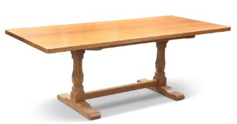 BOB HUNTER, A WRENMAN OAK REFECTORY DINING TABLE, the adzed rectangular top on two carved