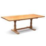 BOB HUNTER, A WRENMAN OAK REFECTORY DINING TABLE, the adzed rectangular top on two carved