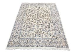 A PERSIAN NAIN CARPET,ÿthe cream field and borders with all-over scrolling pale blue, dark blue