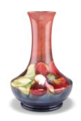 A WALTER MOORCROFT FLAMBÿPOTTERY VASE, squat baluster form with a long flared neck, 'Clematis'