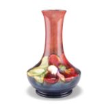 A WALTER MOORCROFT FLAMBÿPOTTERY VASE, squat baluster form with a long flared neck, 'Clematis'