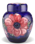 A WALTER MOORCROFT POTTERY GINGER JAR AND COVER,ÿ'Anemone' pattern, tubelined and hand-painted in