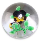 A BACCARAT LAMPWORK PANSY GLASS PAPERWEIGHT, the pansy spray with a central millefiori cane to clear