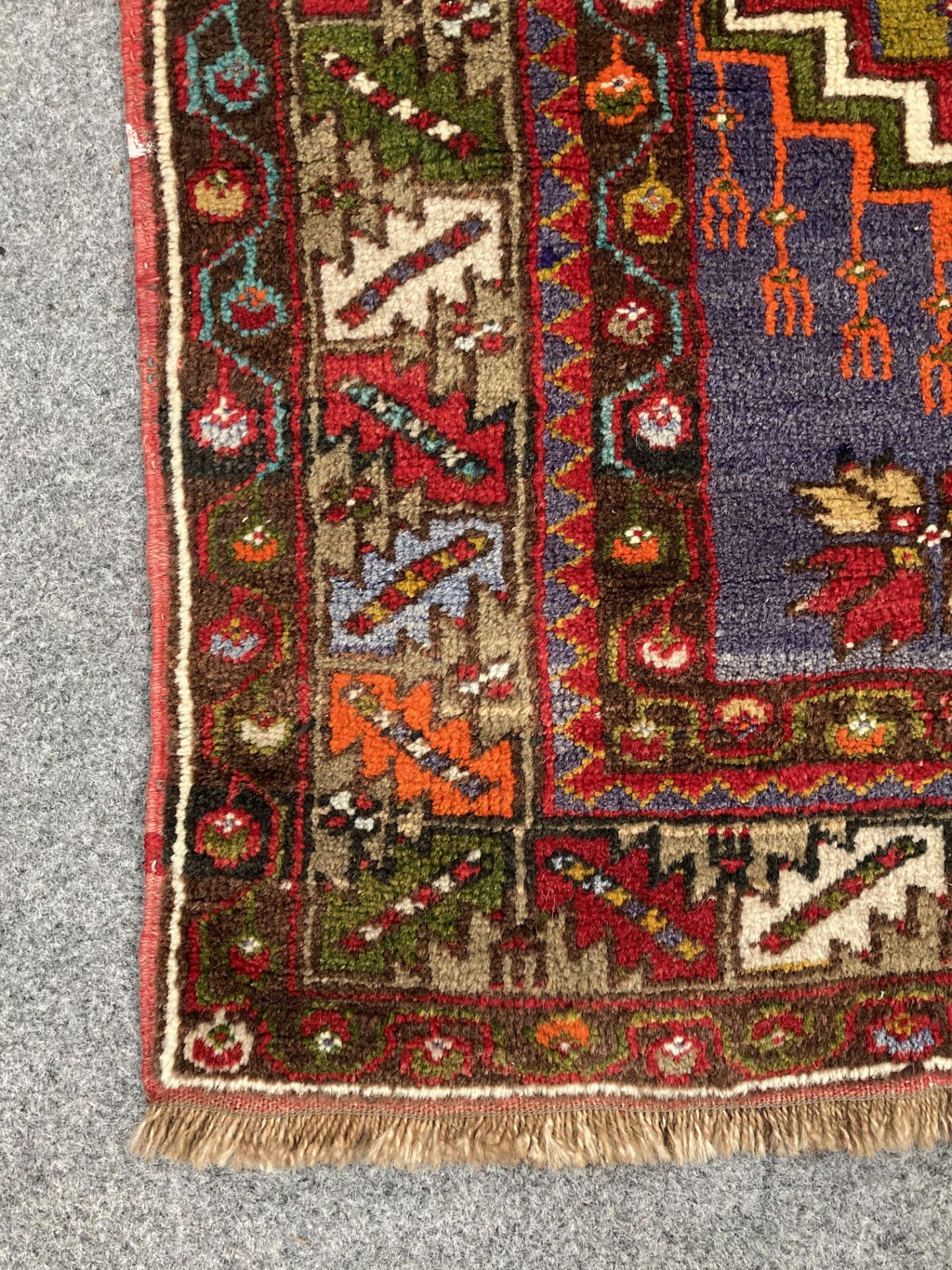 A TURKISH RUG, hand-knotted and multicoloured, the dark red lozenge enclosing a cream medallion, - Bild 3 aus 4