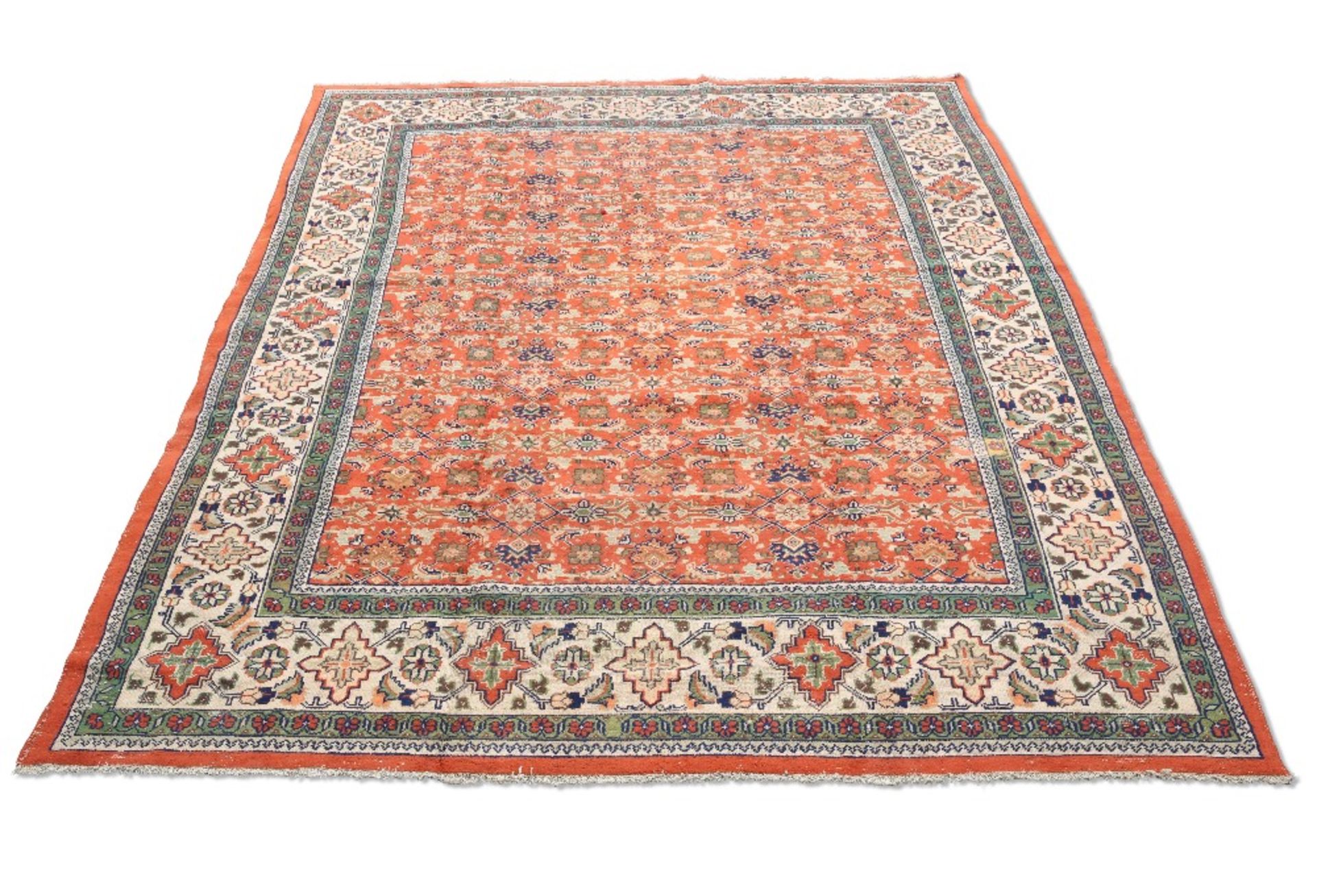 A TURKISH CARPET, CIRCA 1970,ÿthe orange field with all-over design of flowerheads and sprays, the