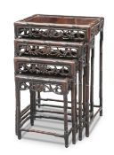 A SET OF FOUR CHINESE HARDWOOD NESTING TABLES, CIRCA 1900,ÿrectangular, each with pierced apron