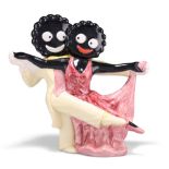 A CARLTON WARE ROBINSONS GOLLY 'FRED ASTAIRE AND GINGER ROGERS' NOVELTY TEAPOT, modelled in a