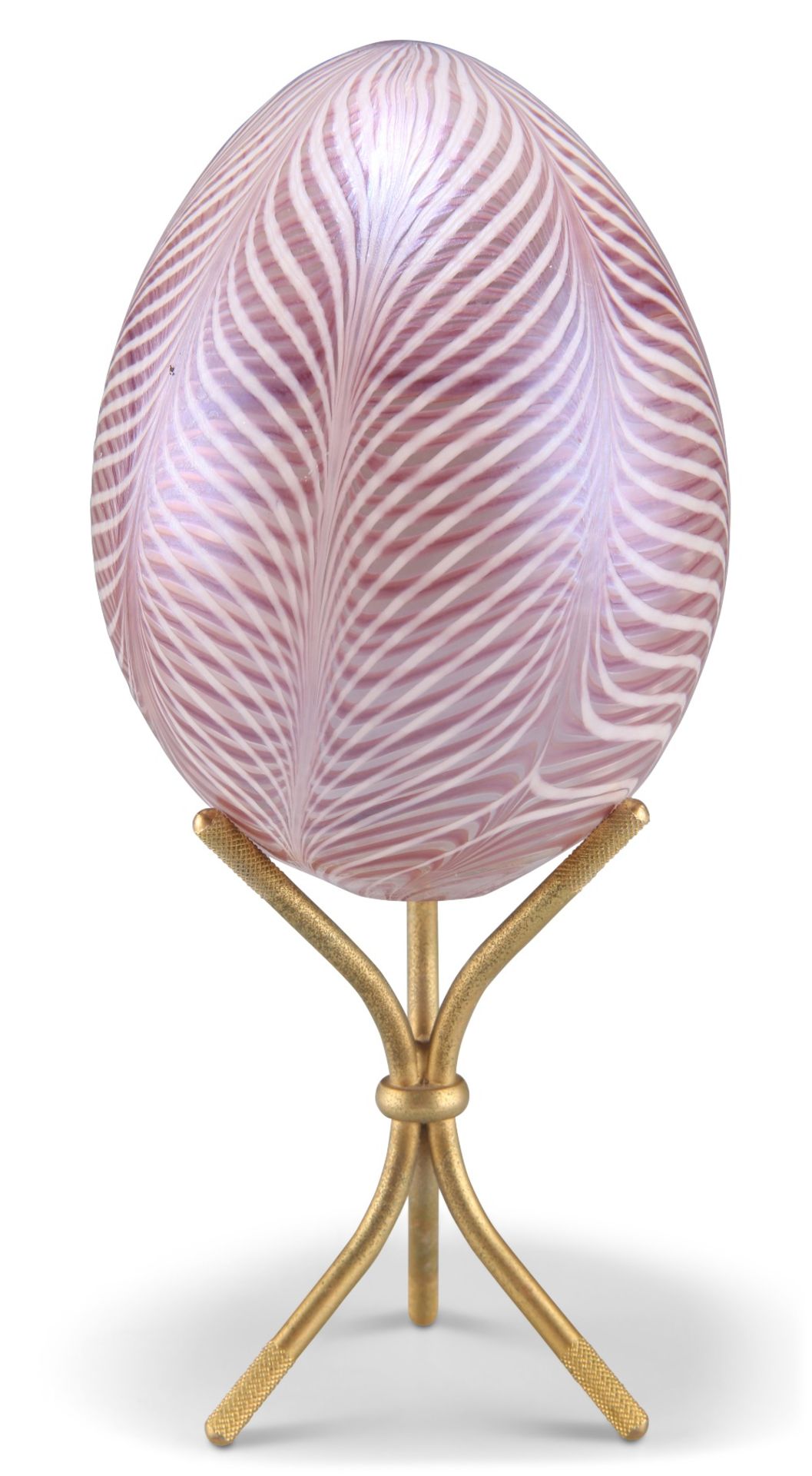 A DAUM GLASS EGG, of feather design, signed and indistinctly numbered, on a brass stand. 19cm high