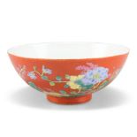 A CHINESE CORAL-GROUND ENAMELLED 'FLORAL' BOWL, circular, painted with clusters of Autumn