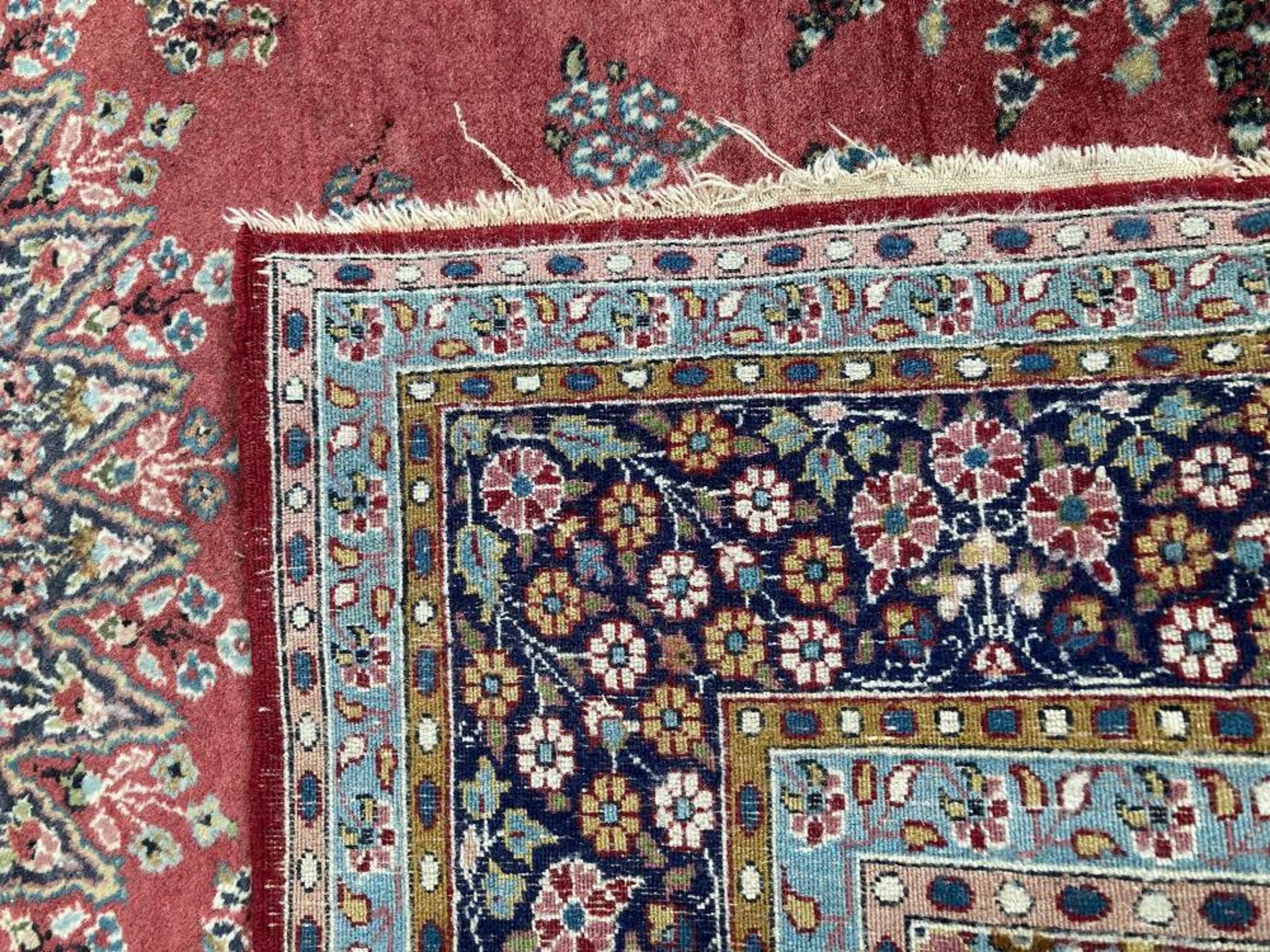 A PERSIAN RUG, hand-knotted, the deep red field with a highly decorative cream and blue circular - Image 4 of 4