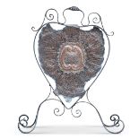 AN ARTS AND CRAFTS COPPER AND WROUGHT IRON FIRESCREEN, of scrolling cartouche form. 91cm high,