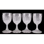 A SET OF FOUR VICTORIAN CUT GLASS WINE GLASSES, theÿbucket bowls with leaf and hobnail decoration