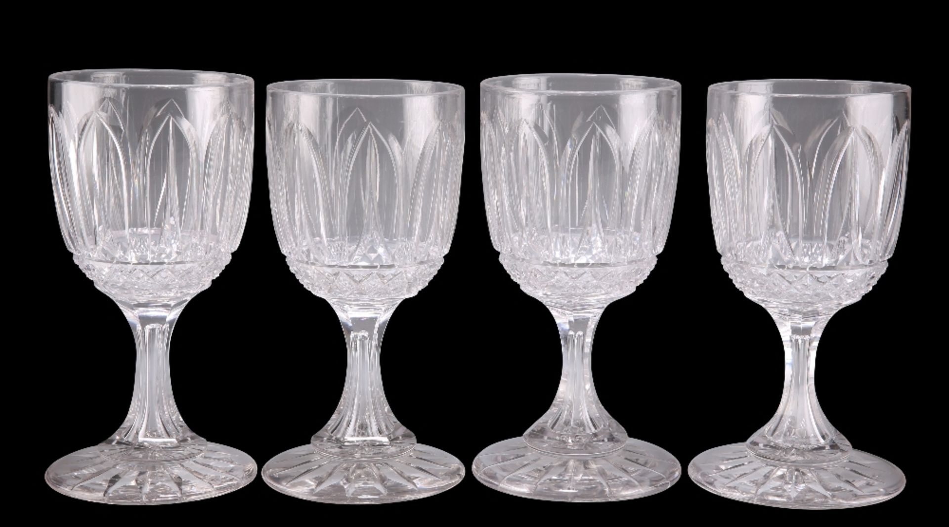A SET OF FOUR VICTORIAN CUT GLASS WINE GLASSES, theÿbucket bowls with leaf and hobnail decoration