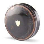 A 19TH CENTURY TORTOISESHELL SNUFF BOX, circular form, the lid inlaid with a central vacant shield
