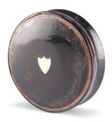 A 19TH CENTURY TORTOISESHELL SNUFF BOX, circular form, the lid inlaid with a central vacant shield