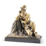 AN ITALIAN BRONZE OF A FISHERMAN, CIRCA 1900, cast reclining on nets and holding a knife, on a