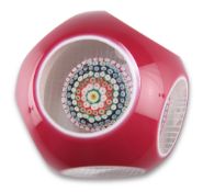 A LARGE MURANO FACETED DOUBLE OVERLAY SIX ROW CONCENTRIC MILLEFIORI PAPERWEIGHT, in red and white