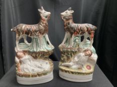 A PAIR OF VICTORIAN STAFFORDSHIRE POTTERY MODELS OF GOATS