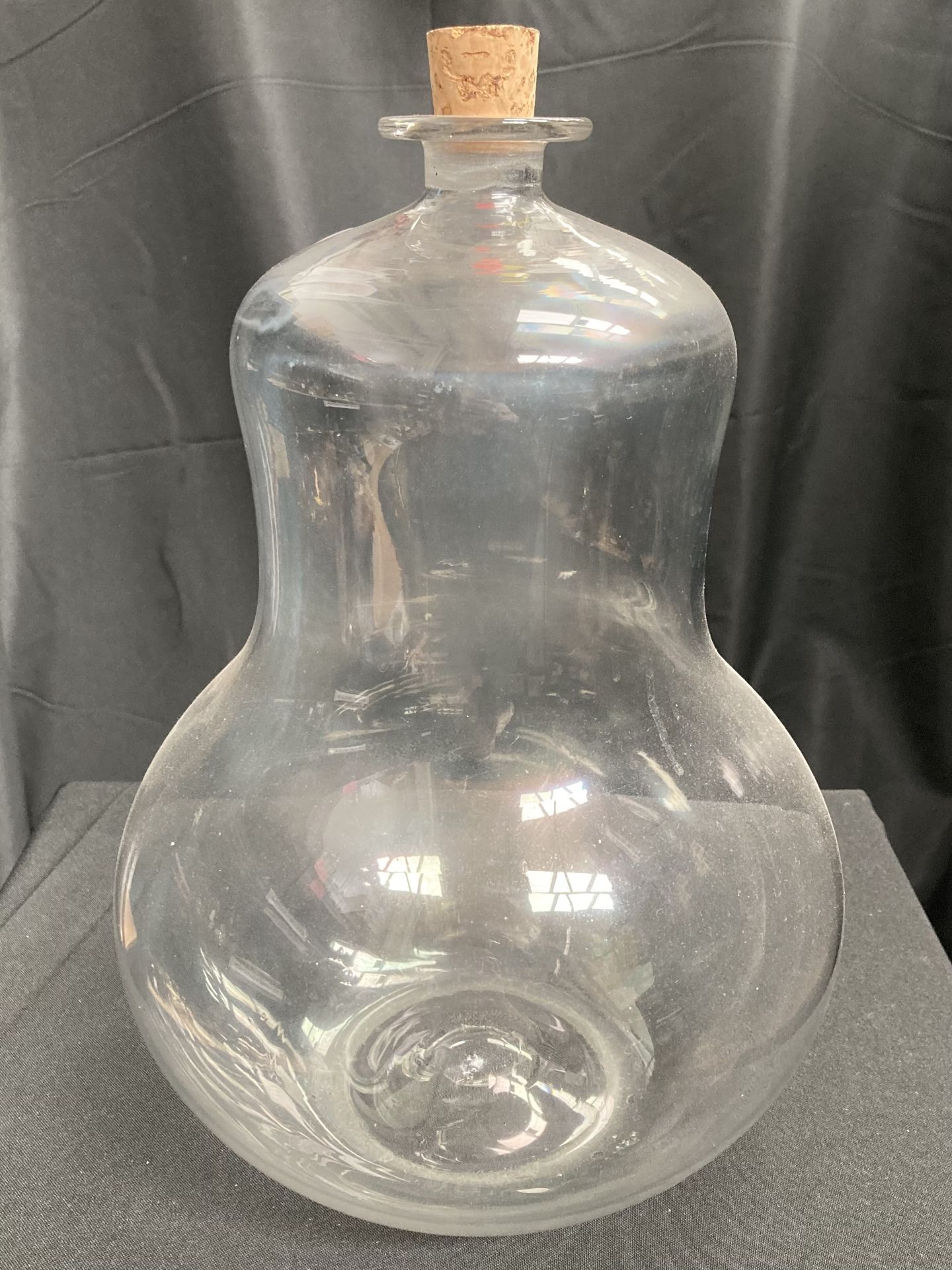 A large clear glass bottle