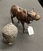 A JAPANESE BRONZE OF A BUFFALO, AND A BRONZE BUDDHA HEAD