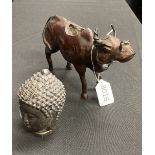 A JAPANESE BRONZE OF A BUFFALO, AND A BRONZE BUDDHA HEAD