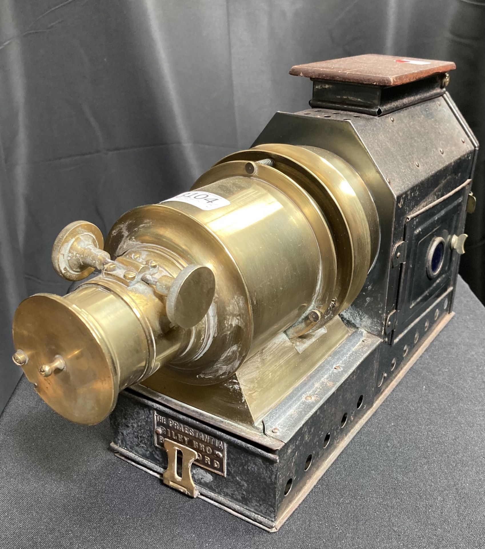 A TIN AND BRASS MAGIC LANTERN AND SLIDES