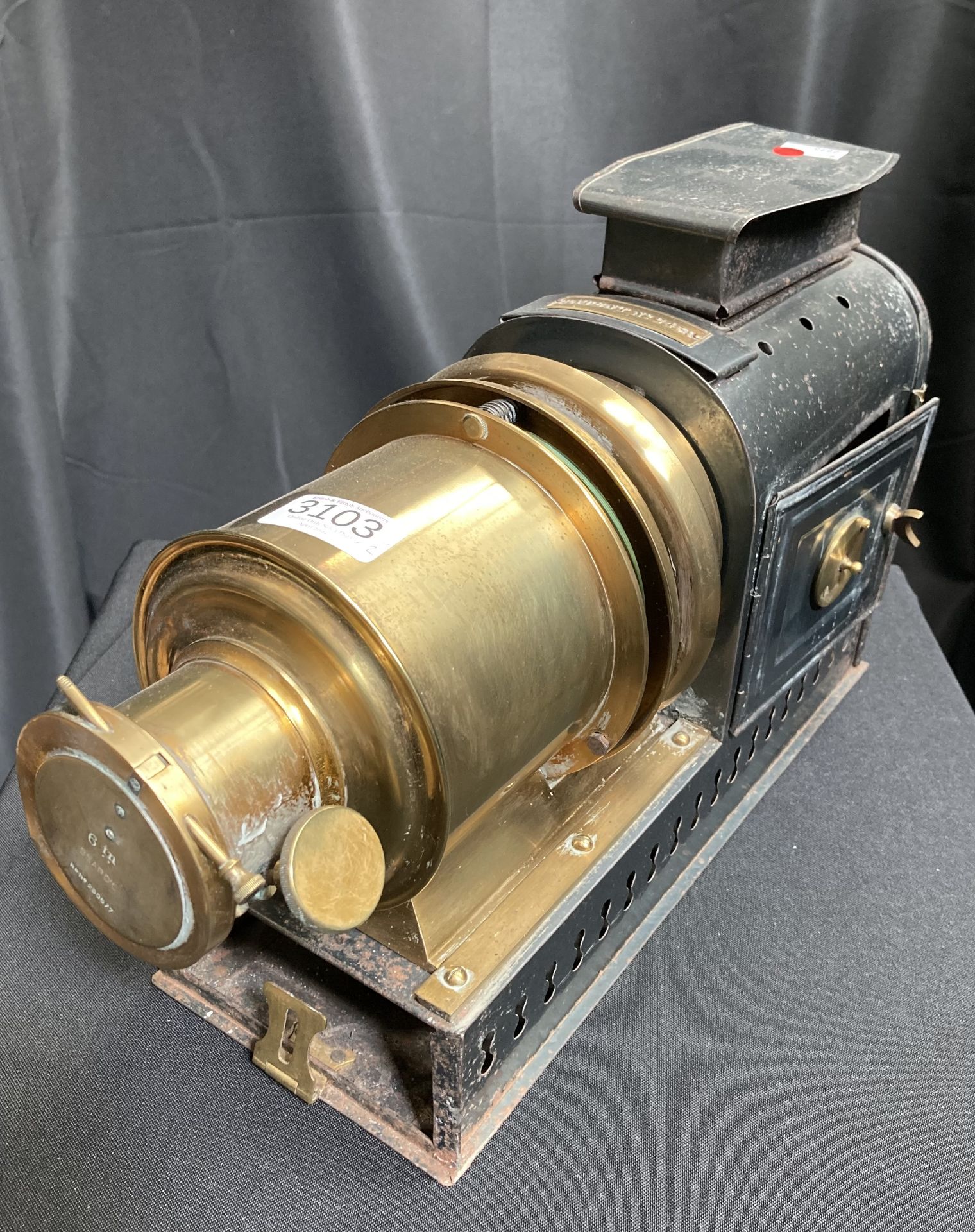 A TIN AND BRASS MAGIC LANTERN AND SLIDES