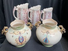 A PAIR OF VASES AND THREE GRADUATED JUGS