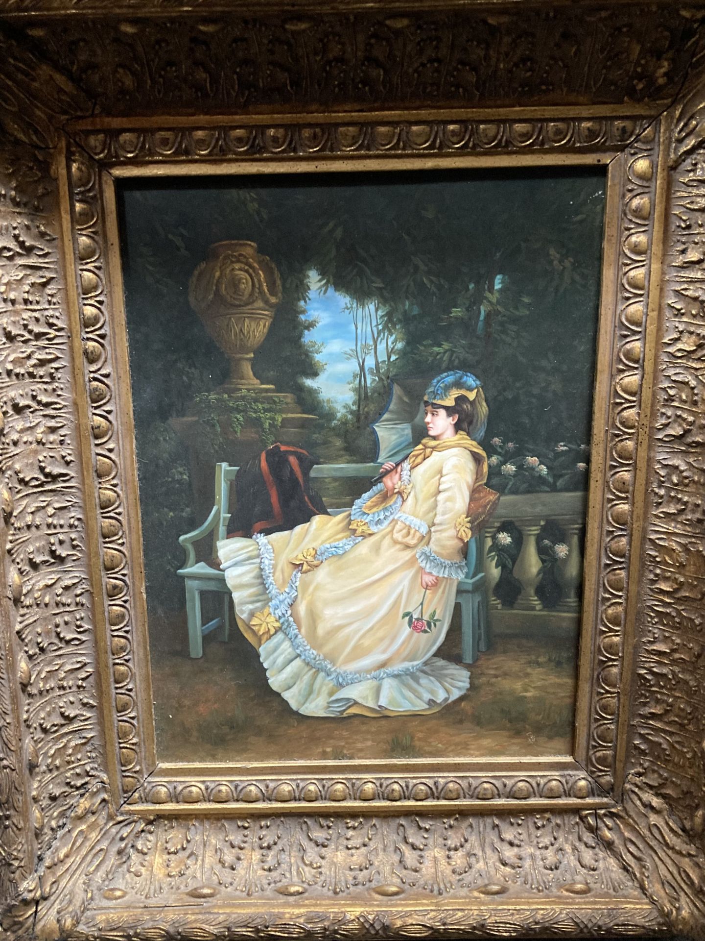LADY SEATED IN A GARDEN