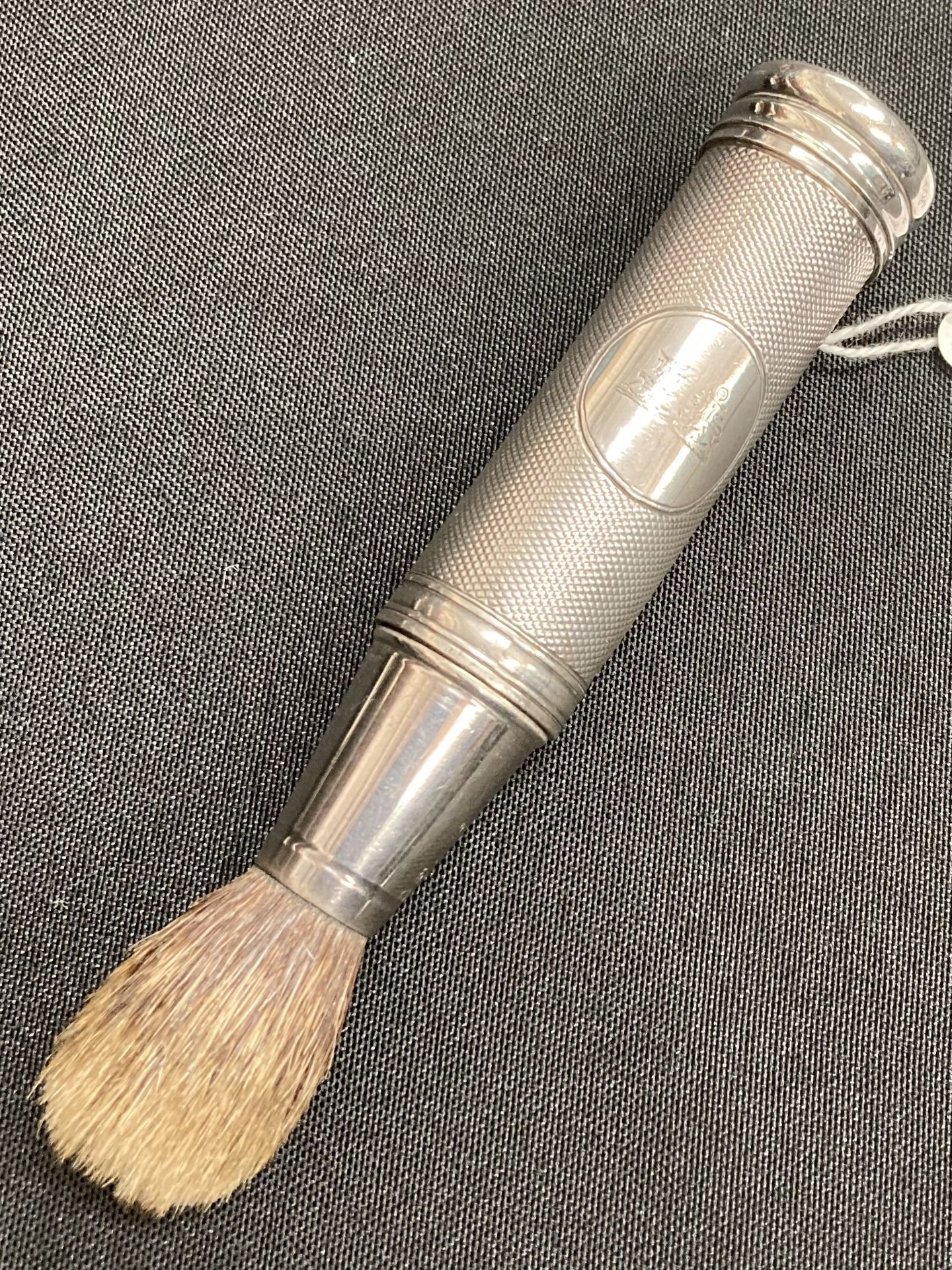 A VICTORIAN SILVER SHAVING BRUSH