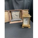A mantel clock and a carriage clock
