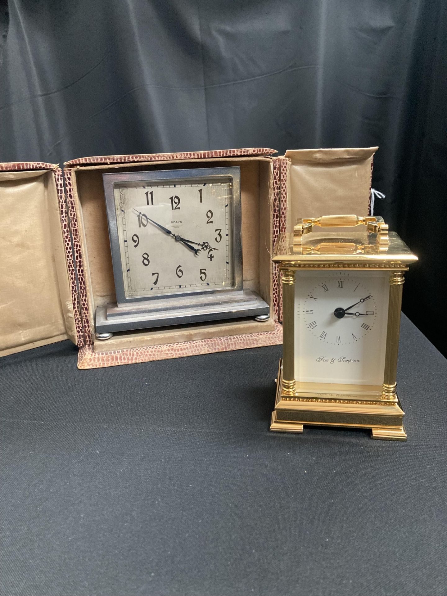 A mantel clock and a carriage clock