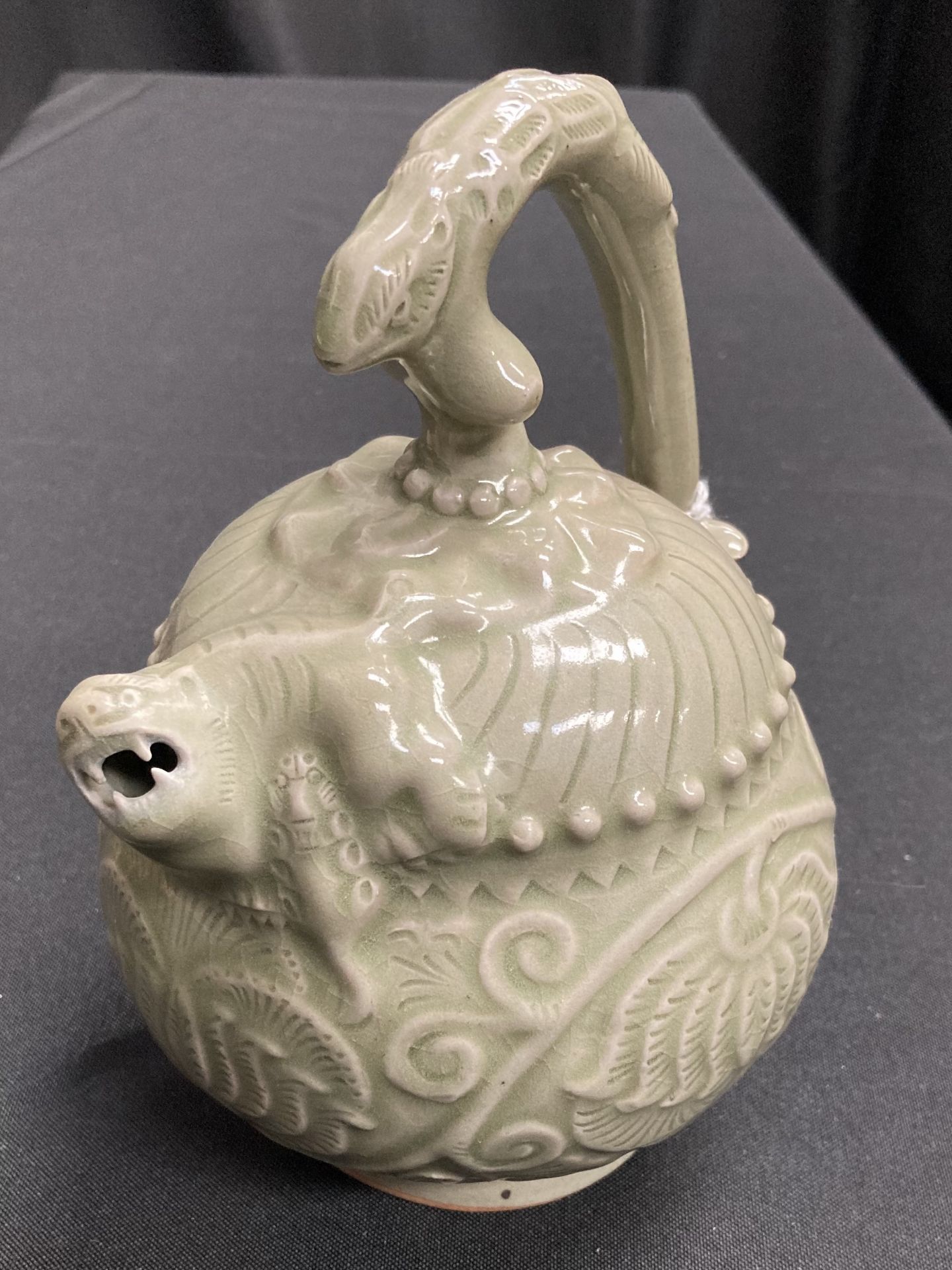 A CHINESE CELADON EWER