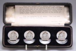 A CASED SET OF FOUR GEORGE V SILVER MENU HOLDERS