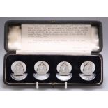 A CASED SET OF FOUR GEORGE V SILVER MENU HOLDERS