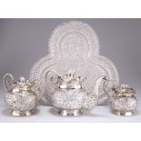 AN INDIAN SILVER THREE-PIECE TEA SERVICE AND TRAY, PROBABLY KASHMIR