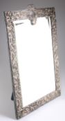 A VERY LARGE EDWARDIAN SILVER-MOUNTED MIRROR