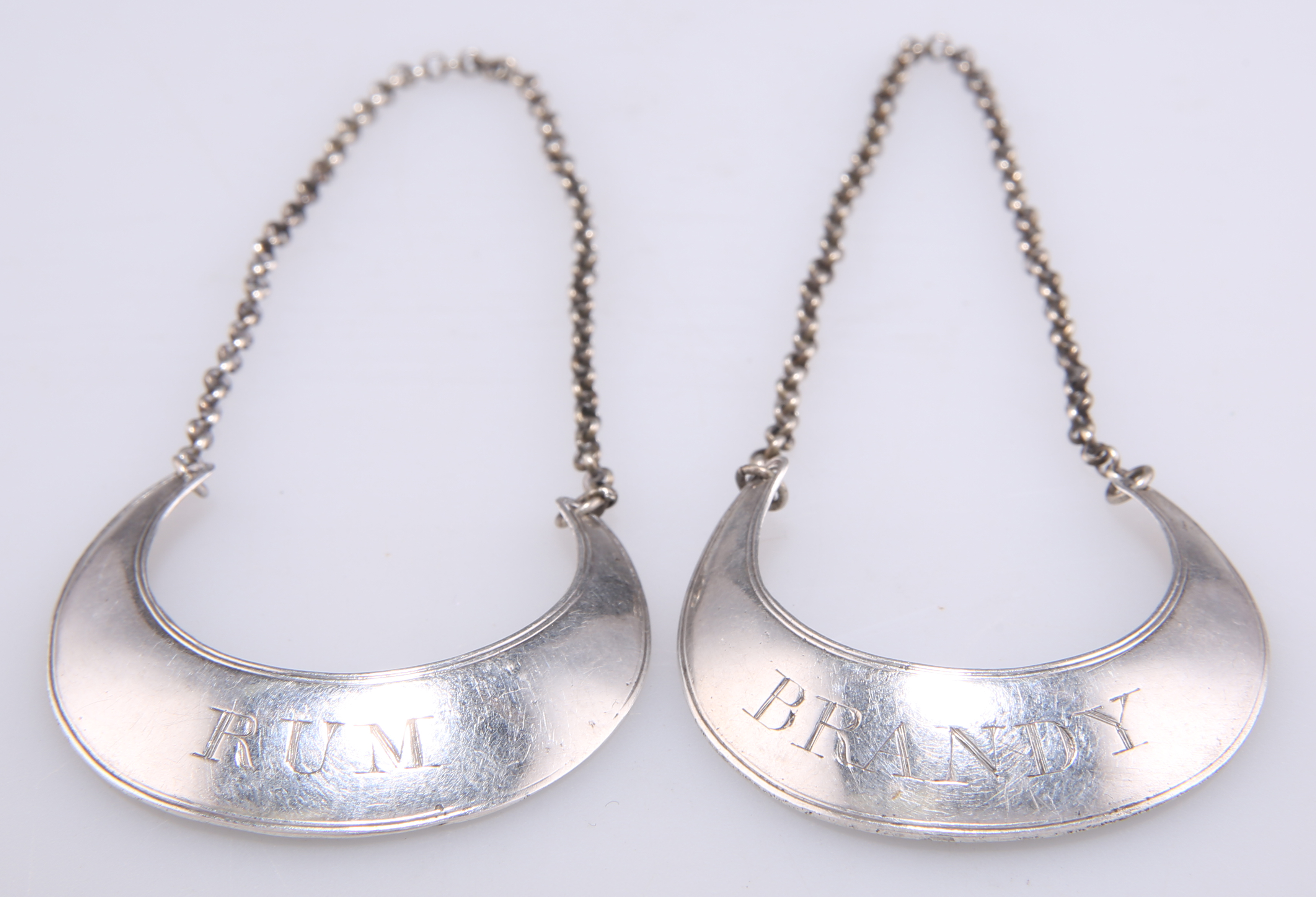 A PAIR OF GEORGE III SILVER WINE LABELS
