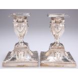 A PAIR OF ADAM REVIVAL SILVER-PLATED CANDLESTICKS