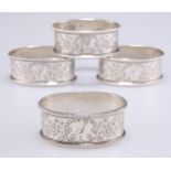 A SET OF FOUR VICTORIAN SILVER NAPKIN RINGS